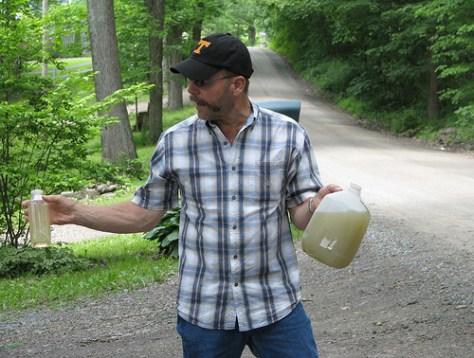 Dimock, Pa. resident Craig Sautner shows off his water.