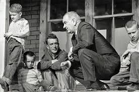 Soon after President Lyndon B. Johnson declared the "War on Poverty" in 1964, he visited Martin County. He was photographed with the Fletcher family on their front porch.